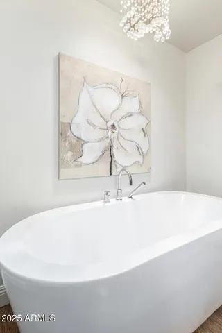 a white bath tub sitting in a bathroom