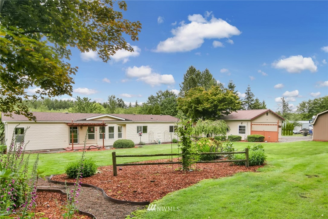 4030 Bay Road Ferndale, WA 98248 - Photo 1 of 36 a front view of house with yard and green space