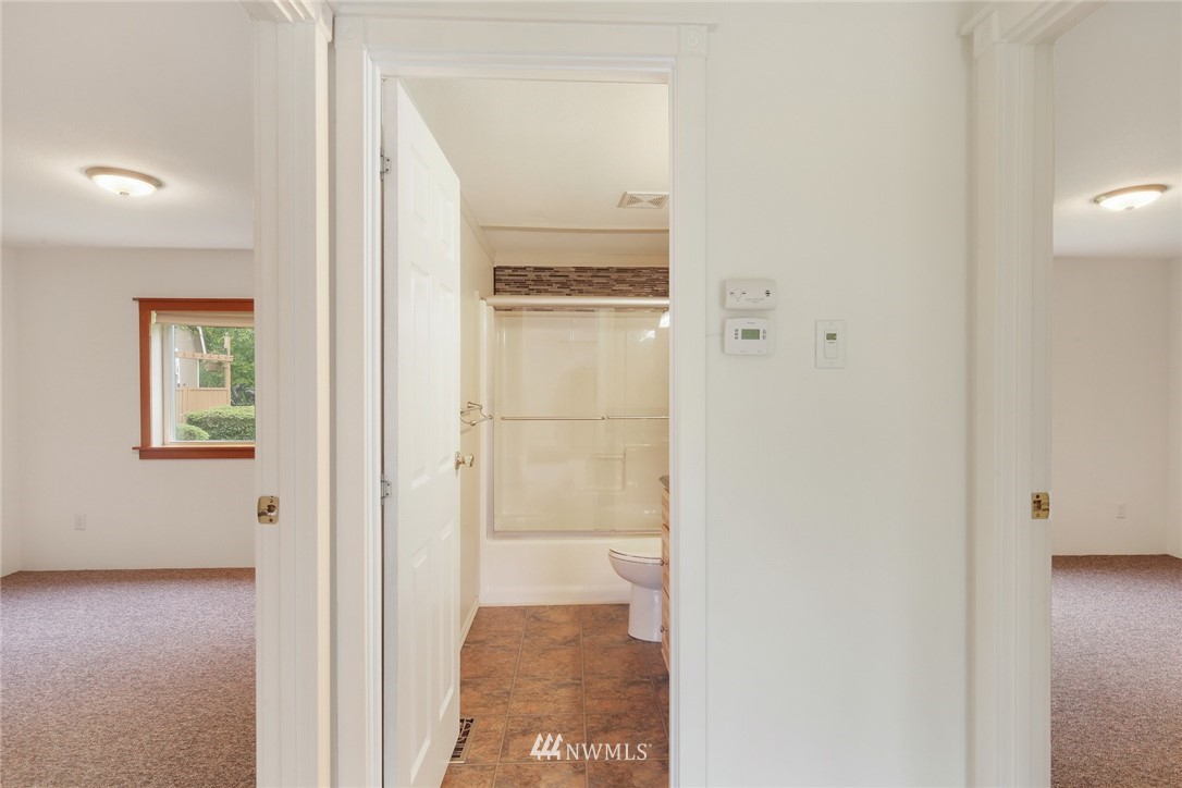 4030 Bay Road Ferndale, WA 98248 - Photo 18 of 36 a view of a hallway with wooden floor and closet