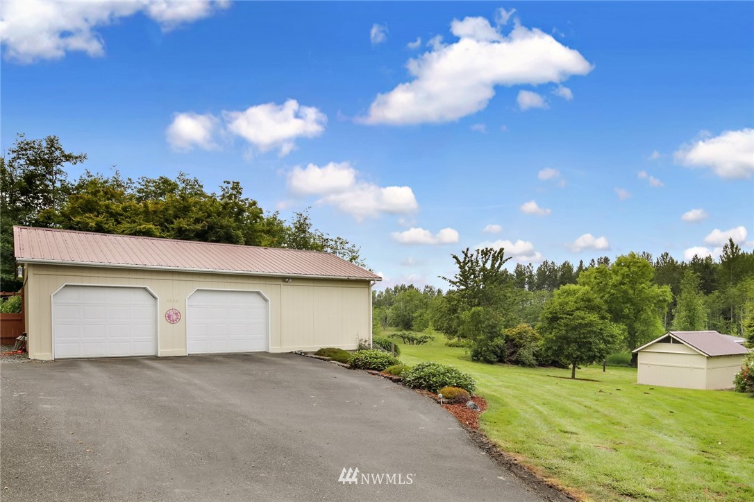 4030 Bay Road Ferndale, WA 98248 - Photo 24 of 36 a view of a big house with a big yard
