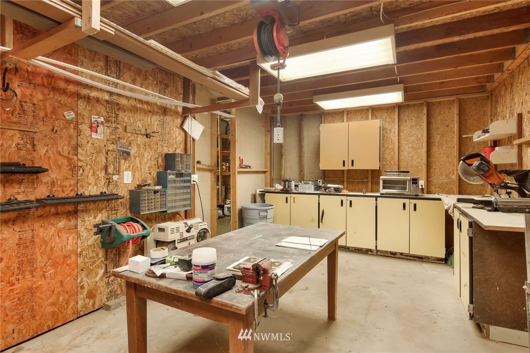 4030 Bay Road Ferndale, WA 98248 - Photo 26 of 36 a living room with stainless steel appliances kitchen island granite countertop furniture and a kitchen view