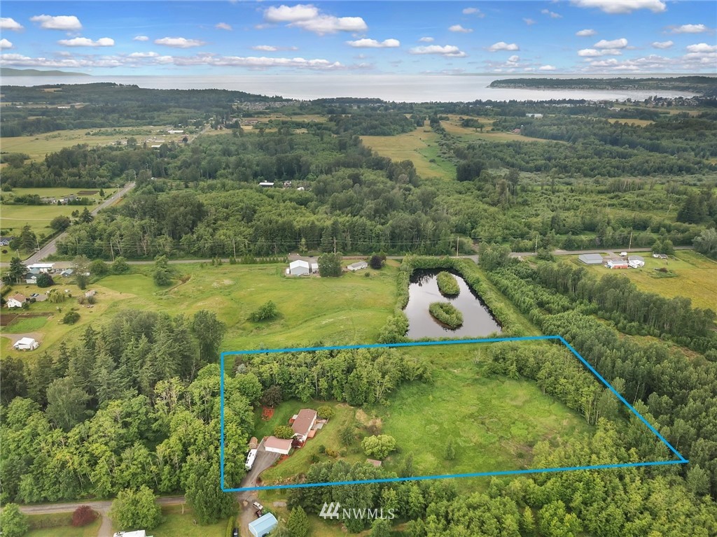 4030 Bay Road Ferndale, WA 98248 - Photo 33 of 36 a view of a lake with a yard