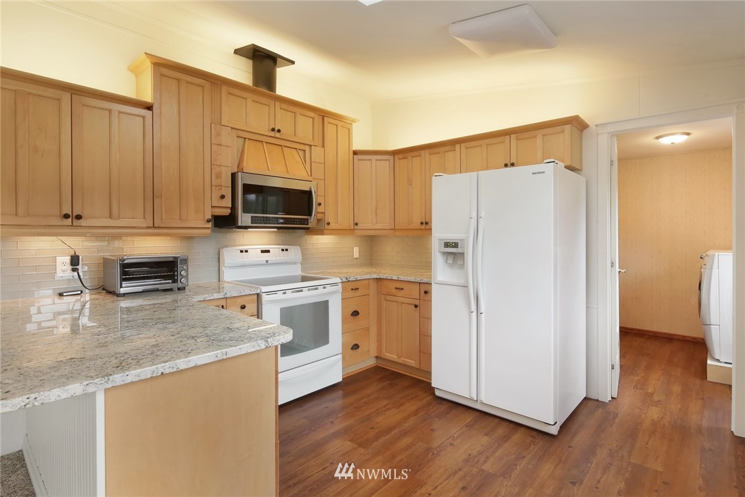 4030 Bay Road Ferndale, WA 98248 - Photo 5 of 36 a kitchen with a refrigerator stove and sink
