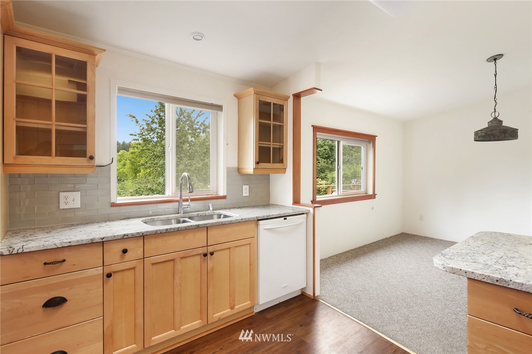 4030 Bay Road Ferndale, WA 98248 - Photo 6 of 36 a kitchen with granite countertop a sink and a window