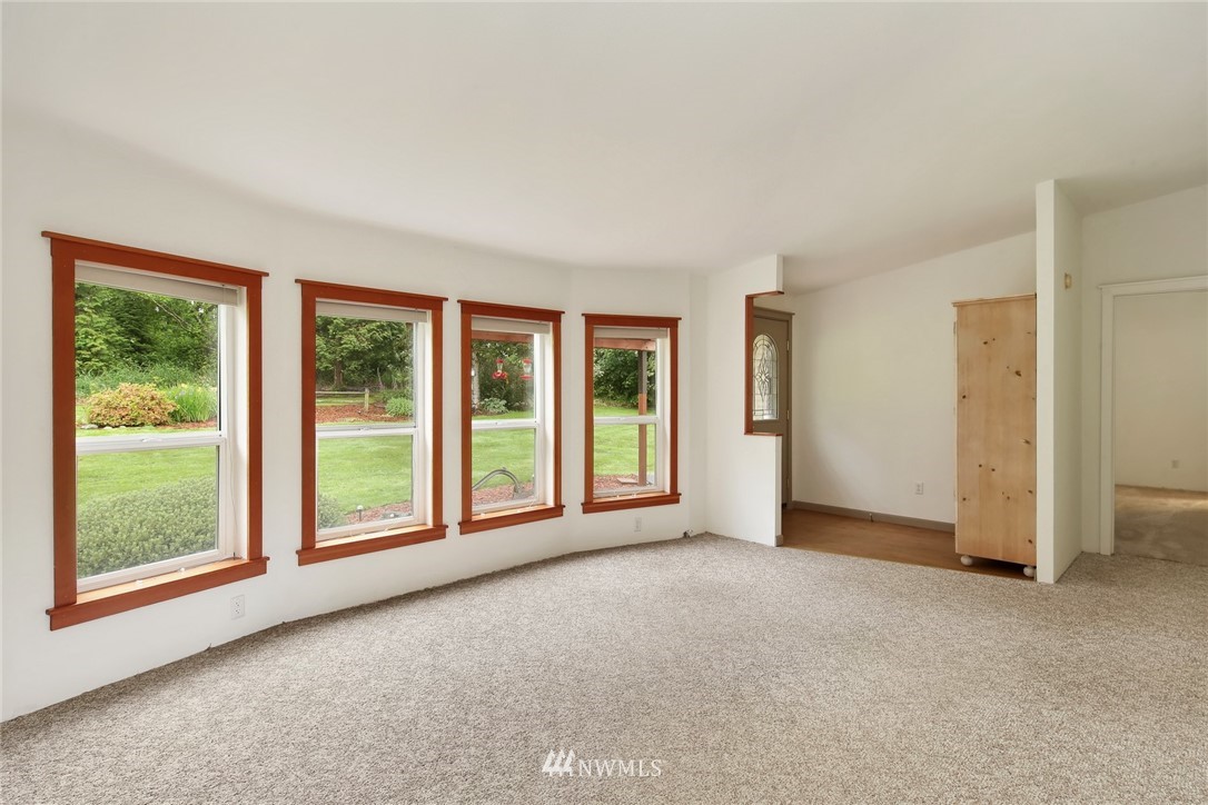 4030 Bay Road Ferndale, WA 98248 - Photo 9 of 36 a view of a big room with windows and kitchen view
