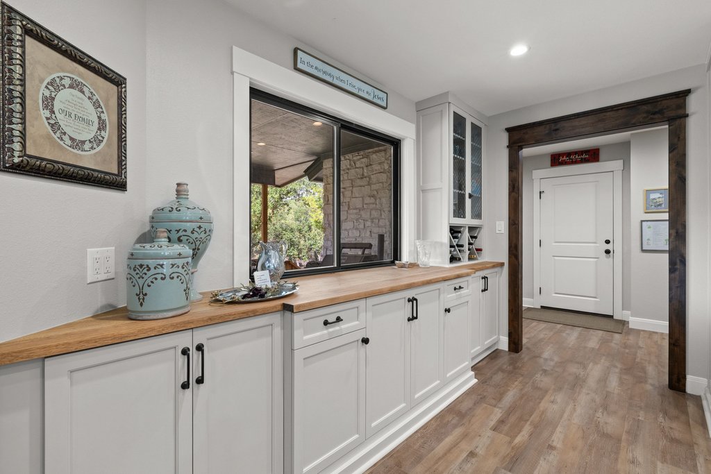 23644 Nameless Road Leander, TX 78641 - Photo 10 of 40 Custom cabinetry with wood countertops and built-in wine storage defines this versatile space.