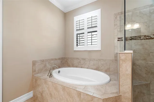 a bathroom with a sink a toilet and a shower