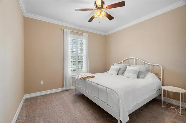 a bedroom with a bed and window