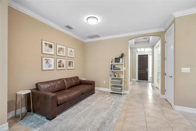 a living room with furniture and a bathroom
