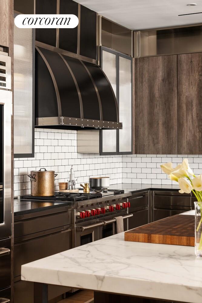 87 Leonard Street, Unit 2 Manhattan, NY 10013 - Photo 12 of 24 a kitchen with a sink and a microwave