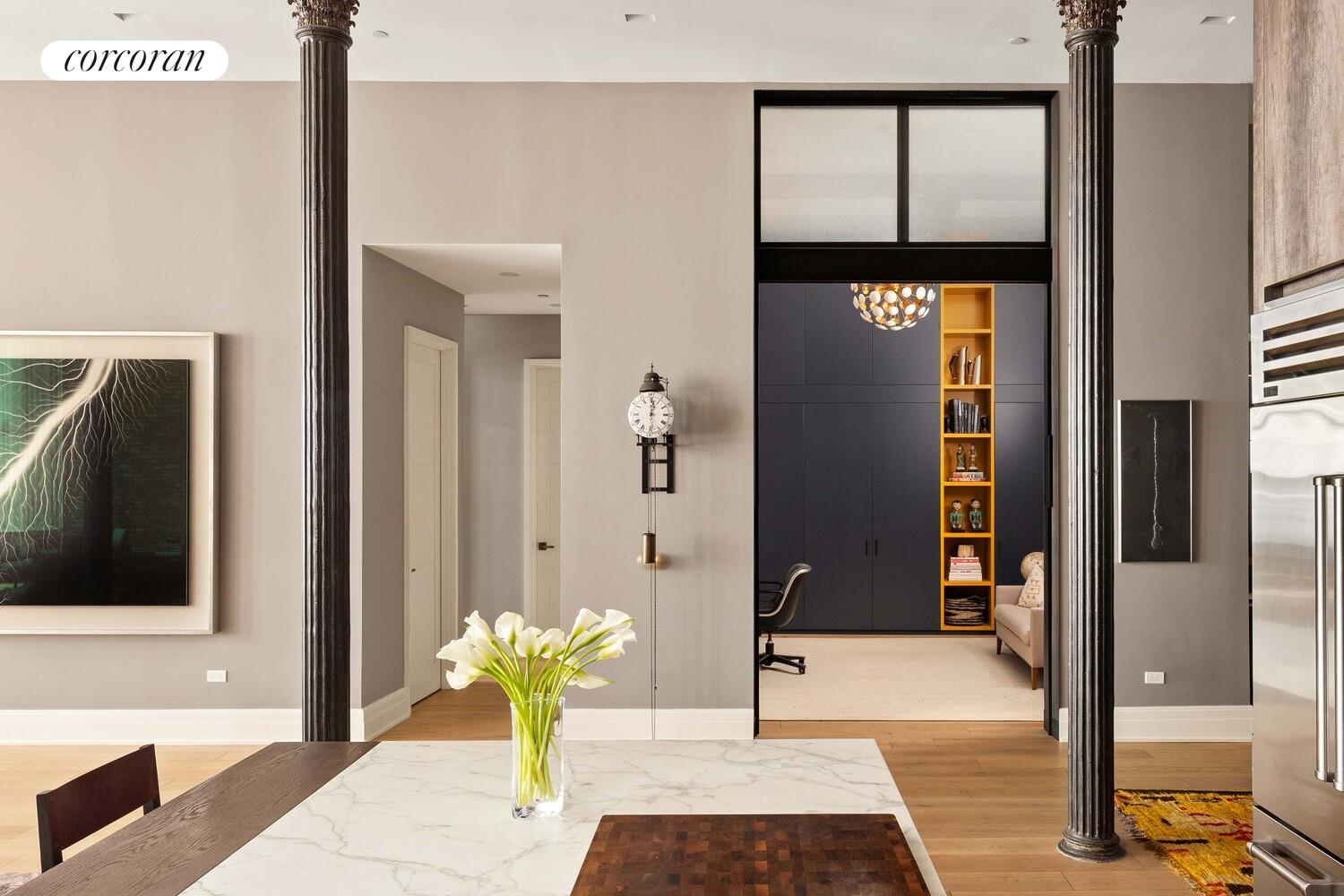 87 Leonard Street, Unit 2 Manhattan, NY 10013 - Photo 13 of 24 a view of a hallway with glass door