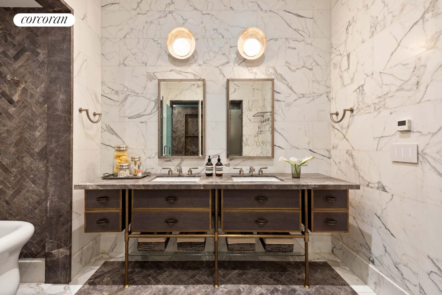 87 Leonard Street, Unit 2 Manhattan, NY 10013 - Photo 17 of 24 a bathroom with a sink and a mirror
