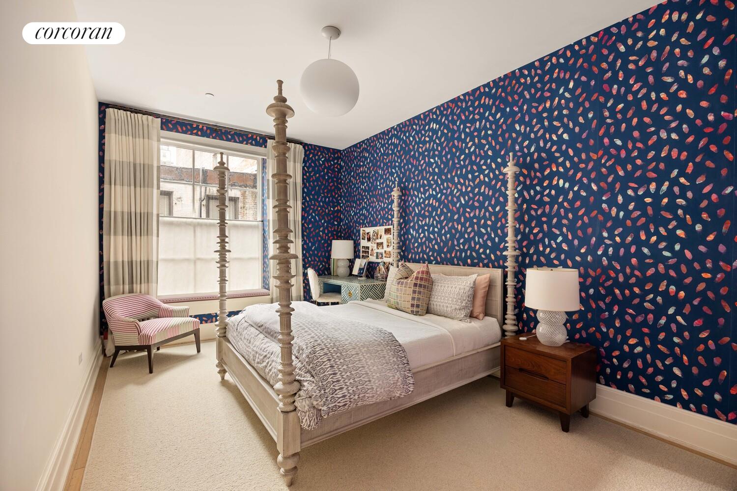 87 Leonard Street, Unit 2 Manhattan, NY 10013 - Photo 18 of 24 a bedroom with a bed chair and a large window