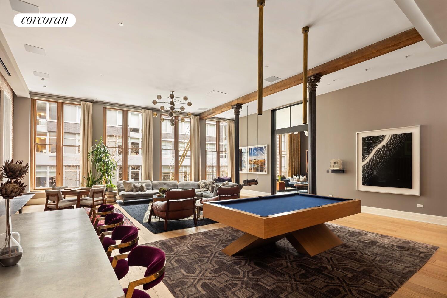 87 Leonard Street, Unit 2 Manhattan, NY 10013 - Photo 4 of 24 a living room with furniture a rug and a floor to ceiling window