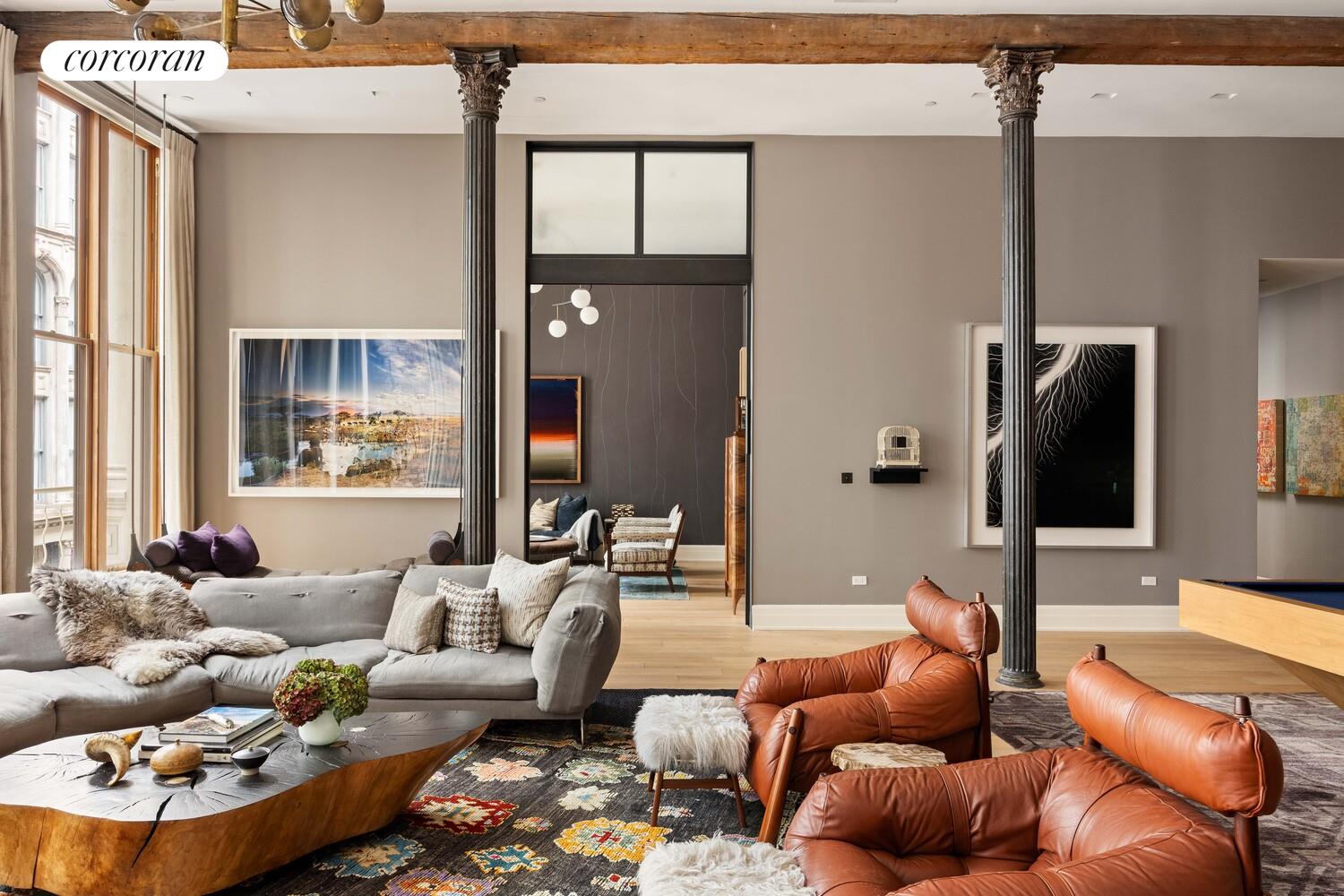 87 Leonard Street, Unit 2 Manhattan, NY 10013 - Photo 6 of 24 a living room with furniture and a flat screen tv