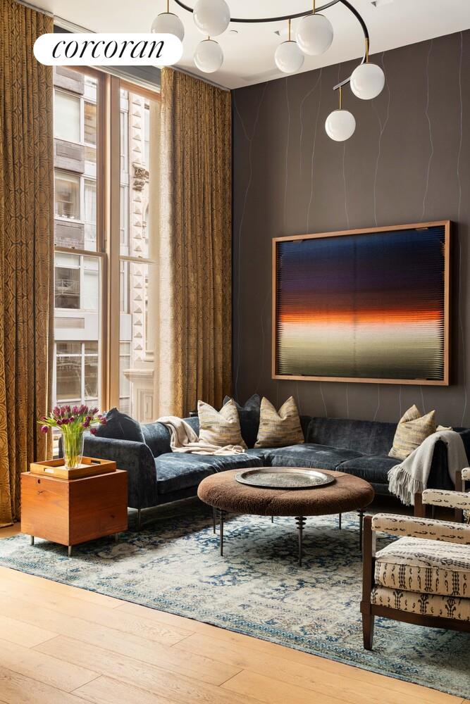 87 Leonard Street, Unit 2 Manhattan, NY 10013 - Photo 8 of 24 a living room with furniture and a lamp