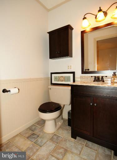 8703 Clydesdale Road Springfield, VA 22151 - Photo 22 of 28 a bathroom with a sink a toilet and mirror
