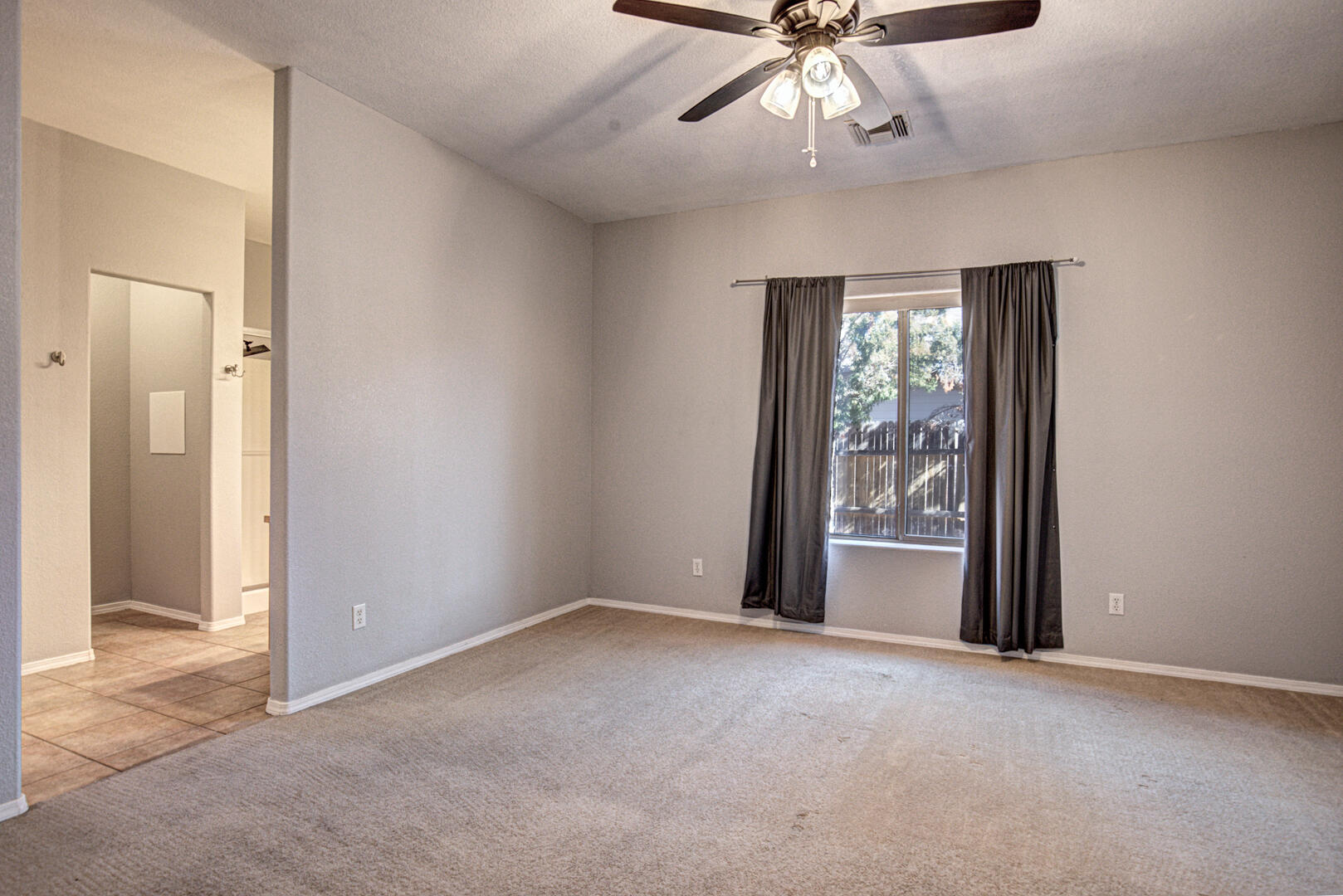 334 East Cedar Mill Road Star Valley, AZ 85541 - Photo 13 of 32 an empty room with windows and fan