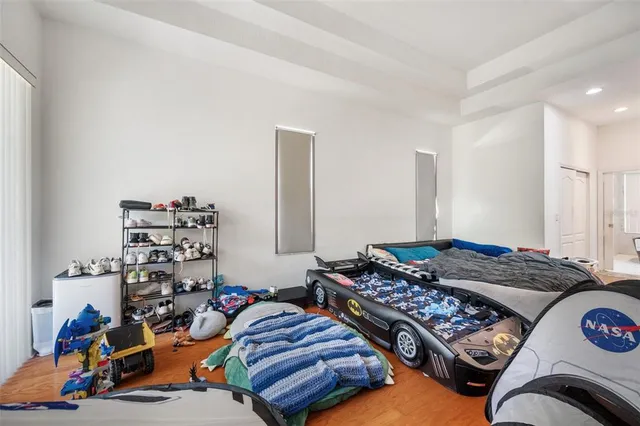 a kitchen with a sink a toilet and a shower