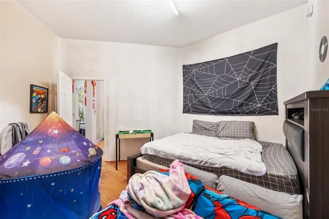 a large kitchen with stainless steel appliances granite countertop a stove and a sink