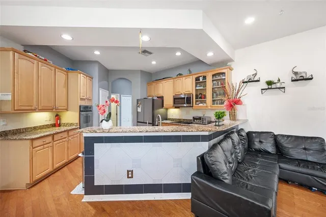 a kitchen with stainless steel appliances granite countertop a stove and a sink