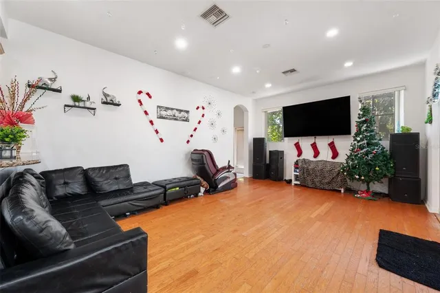 a view of a workspace with furniture and wooden floor