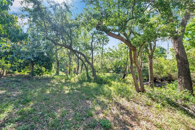 a building outdoor space with patio furniture and potted plants