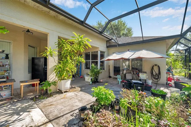 an aerial view of a house with a lake view