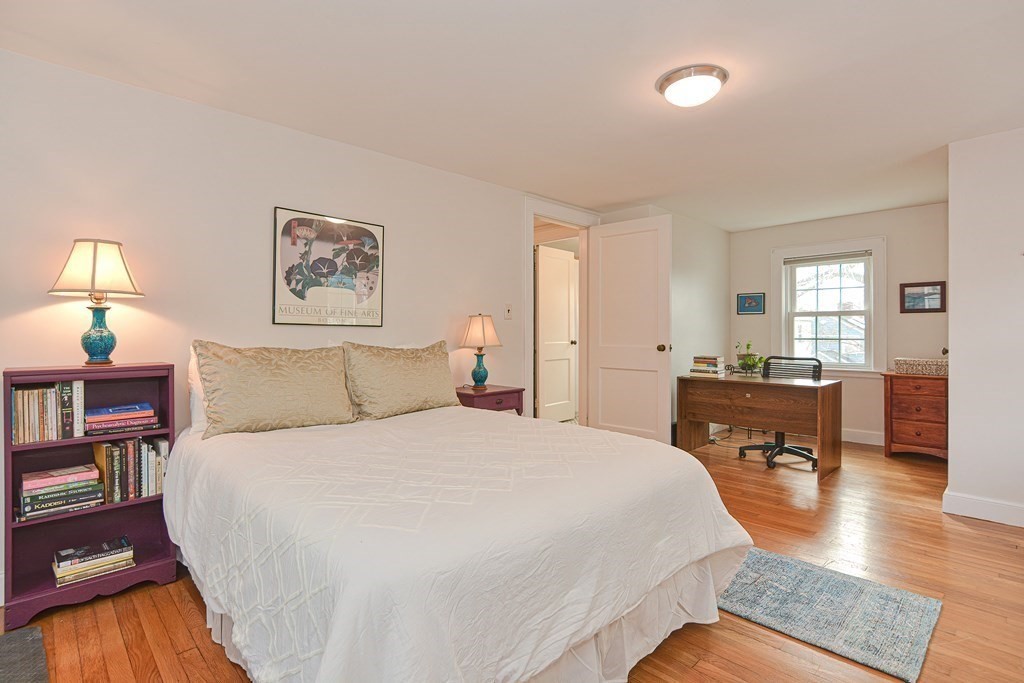 95 Southbourne Road Boston, MA 02130 - Photo 12 of 29 a spacious bedroom with a bed a table and chair