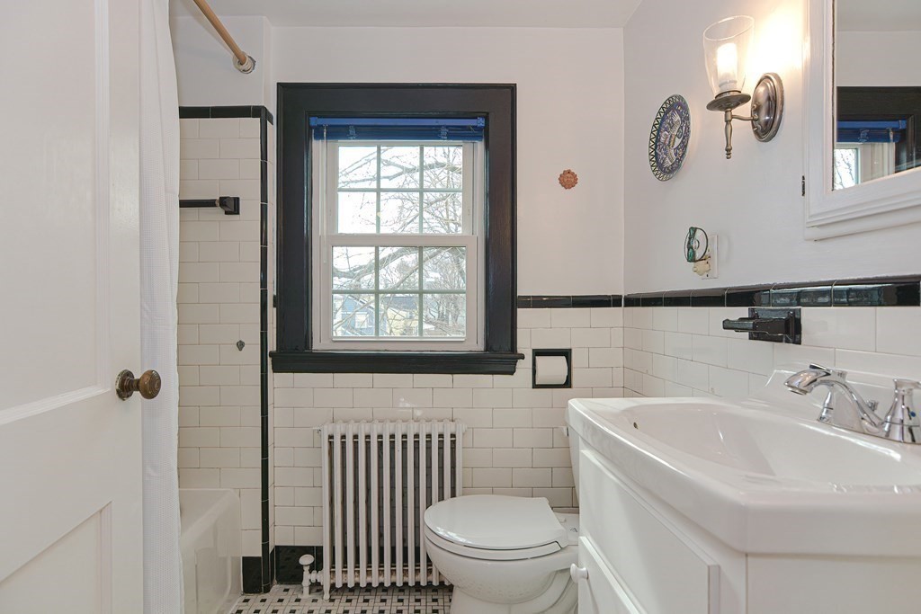 95 Southbourne Road Boston, MA 02130 - Photo 18 of 29 a bathroom with a sink and a toilet