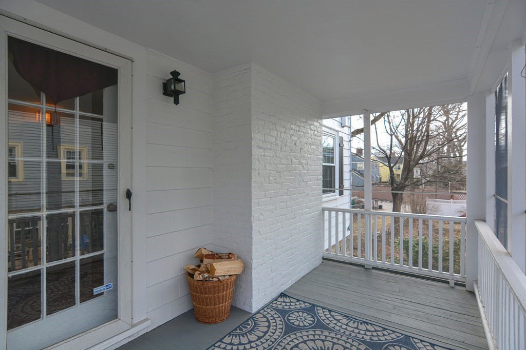 95 Southbourne Road Boston, MA 02130 - Photo 20 of 29 a view of a porch with wooden floor and fence