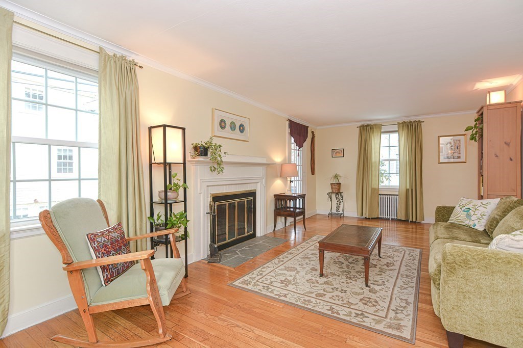 95 Southbourne Road Boston, MA 02130 - Photo 3 of 29 a living room with furniture and a fireplace
