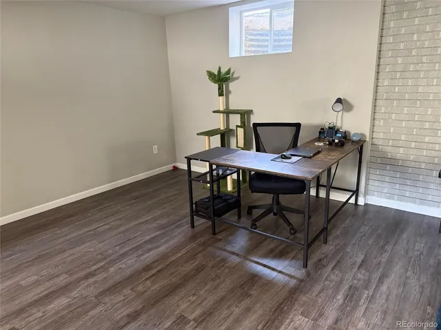 a workspace with furniture and wooden floor