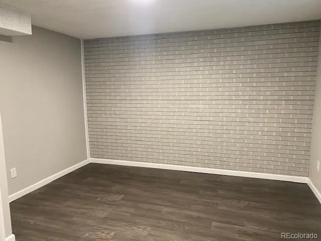 a view of a small space with wooden floor