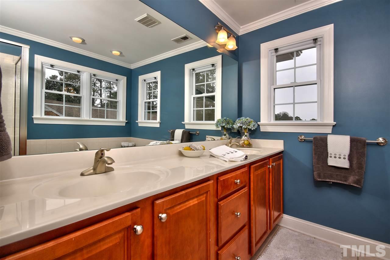 1100 Silas Ridge Court Raleigh, NC 27609 - Photo 14 of 24 a bathroom with a sink double vanity and a window