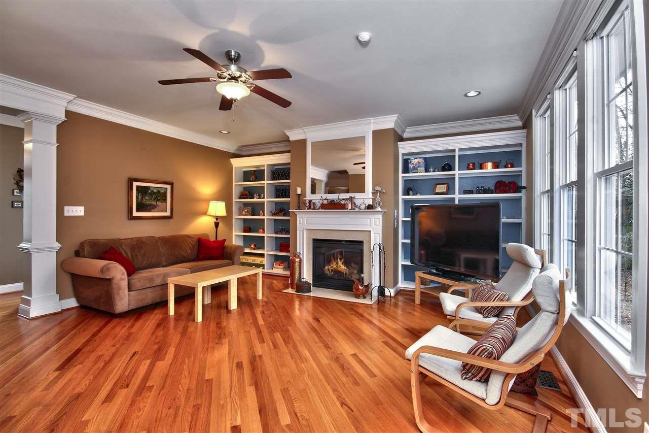 1100 Silas Ridge Court Raleigh, NC 27609 - Photo 4 of 24 a living room with furniture a flat screen tv and a fireplace