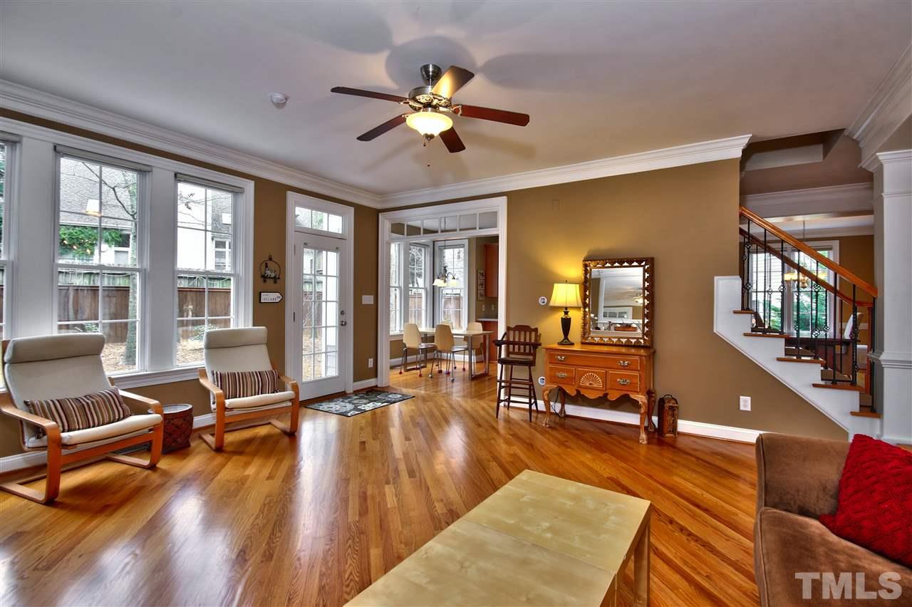 1100 Silas Ridge Court Raleigh, NC 27609 - Photo 5 of 24 a living room with furniture pool table wooden floor and a large window