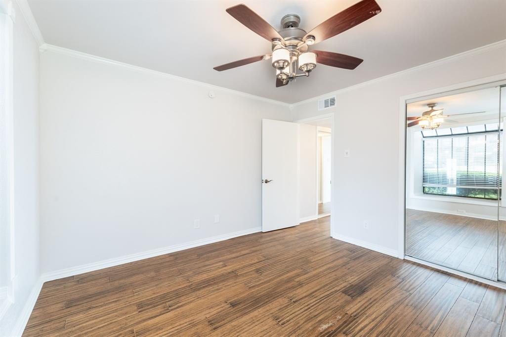 4610 Chaha Road, Unit 106 Garland, TX 75043 - Photo 15 of 25 wooden floor in an empty room with a window