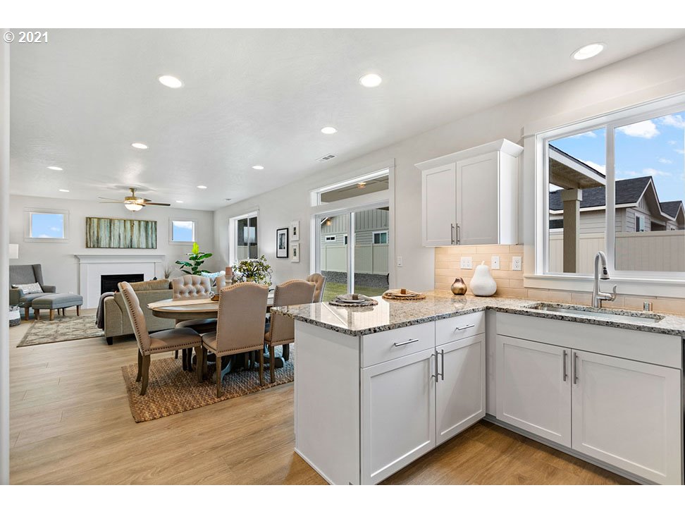 5110 Squirrel Street Springfield, OR 97478 - Photo 2 of 11 a kitchen with a sink and cabinets