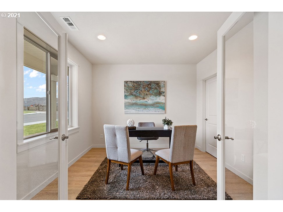 5110 Squirrel Street Springfield, OR 97478 - Photo 3 of 11 a view of a dining room with furniture and a window