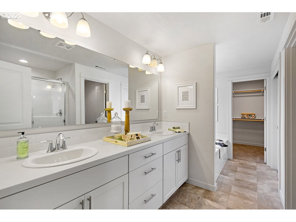5110 Squirrel Street Springfield, OR 97478 - Photo 7 of 11 a bathroom with a sink double vanity granite and a mirror