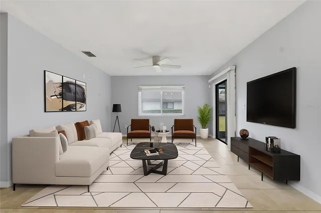 a living room with furniture and a flat screen tv