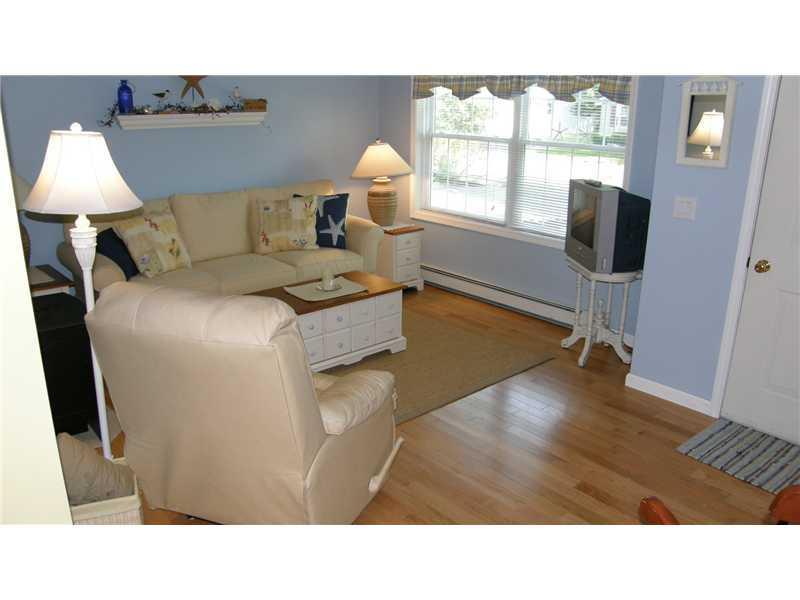 32 Depot Road Wells, ME 04090 - Photo 4 of 25 Living Room. Warm wood floors, large...