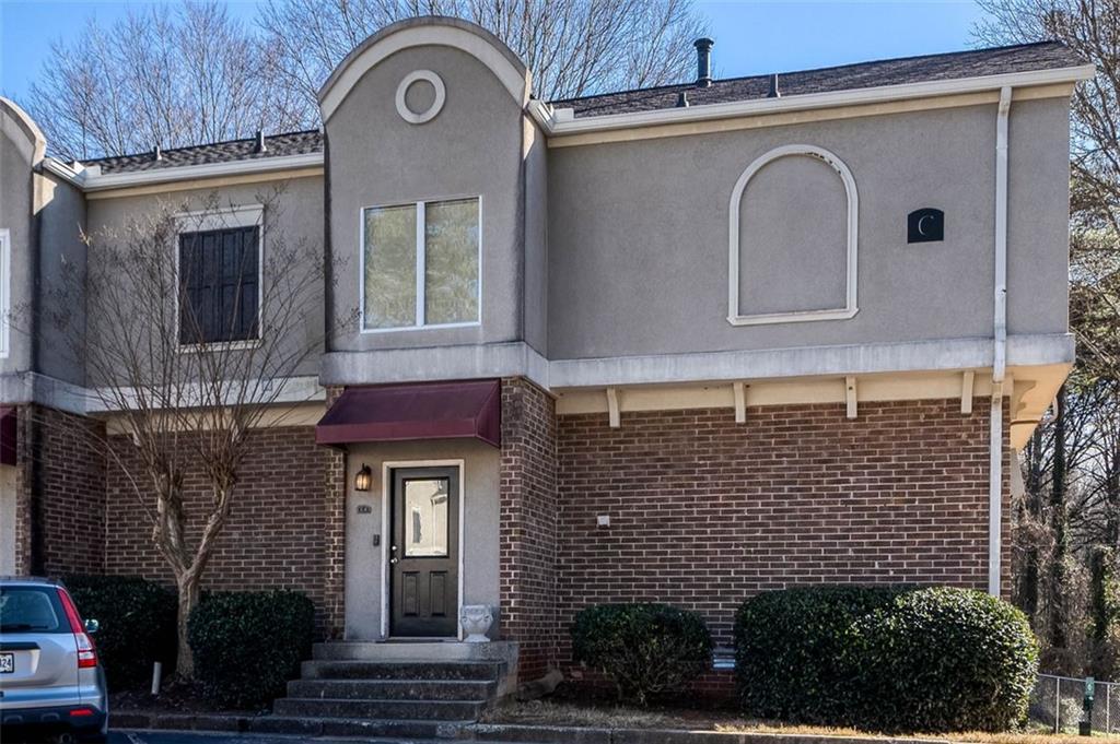 3301 Henderson Mill Road, Unit C6 Atlanta, GA 30341 - Photo 1 of 1 a front view of a house with large windows