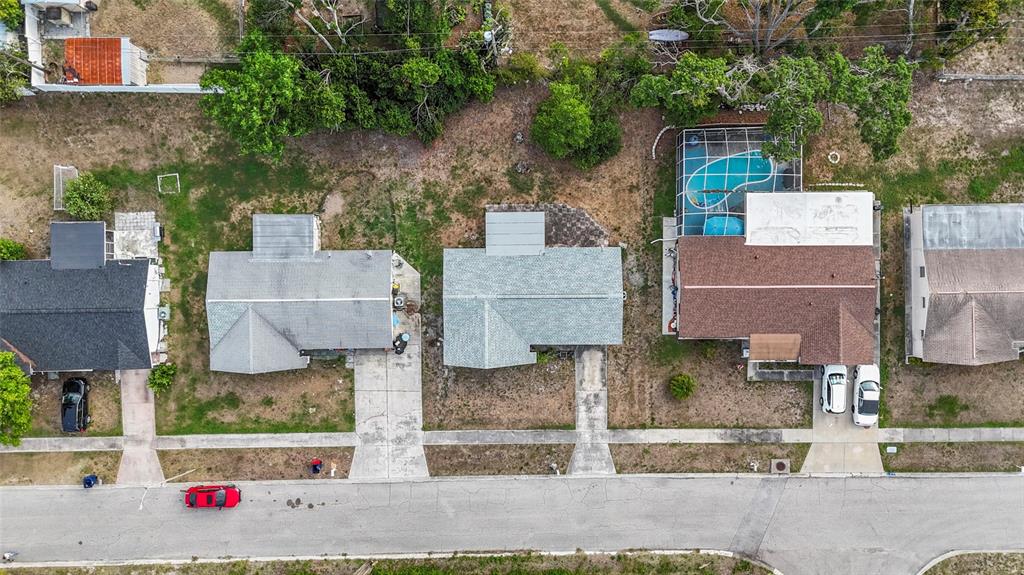 1623 Plum Tree Road Holiday, FL 34690 - Photo 33 of 33 an aerial view of residential houses with outdoor space