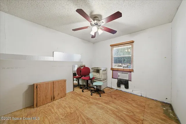 a work room with furniture and windows