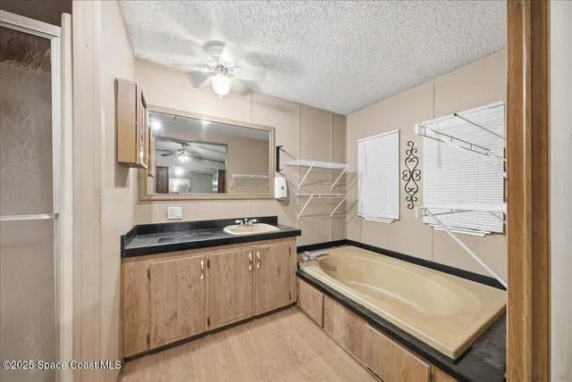 a kitchen with stainless steel appliances granite countertop a stove and a refrigerator