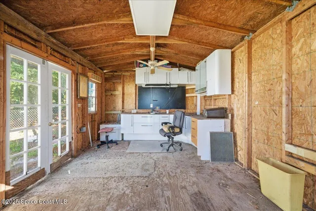 a view of living room with furniture and flat screen tv