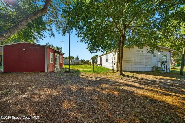a view of backyard with green space