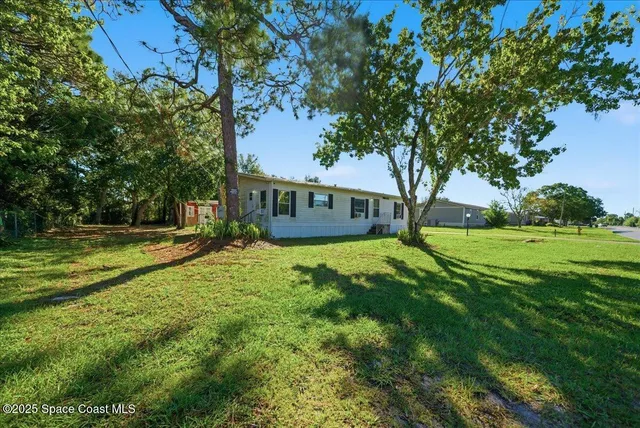 a view of a house with a big yard